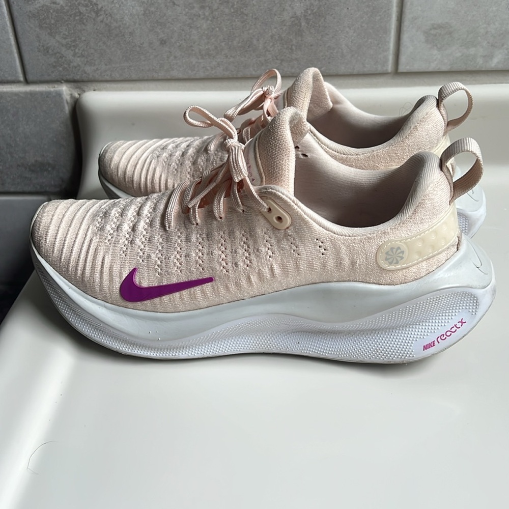 Nike Women's Athletic Shoes in light pink/peach  with fuchsia accents.